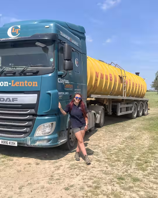image of HGV trainee stood with HGV vehicle in field
