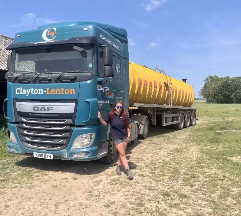 image of HGV trainee stood with HGV vehicle in field