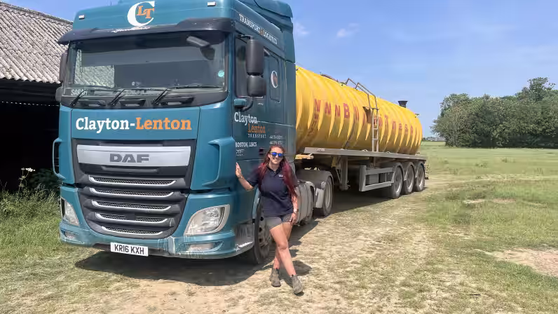 image of HGV trainee stood with HGV vehicle in field